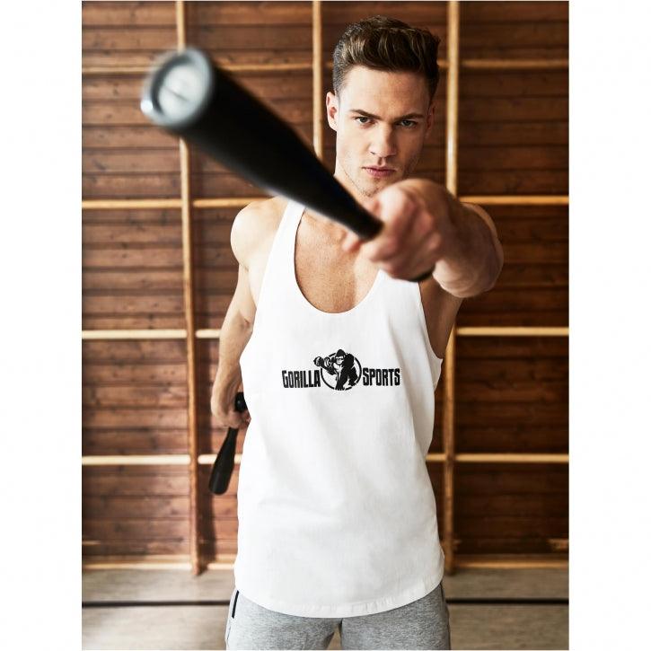 Uomo in canotta Gorilla Sports impugna una mazza in palestra, abbigliamento fitness bodybuilding