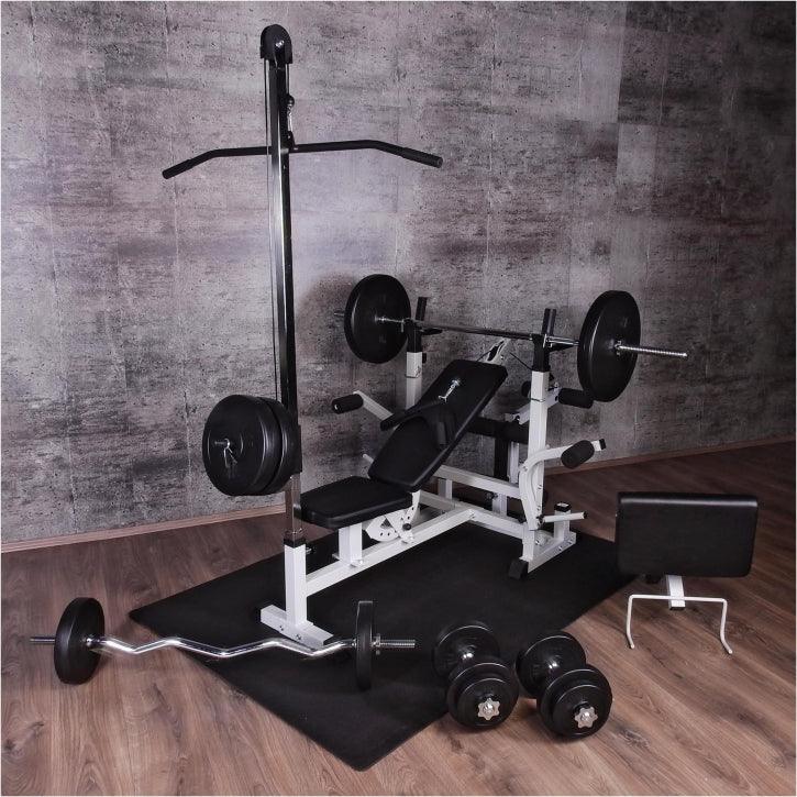 Panca multifunzione con pesi, bilanciere e manubri in palestra Gorilla Sports